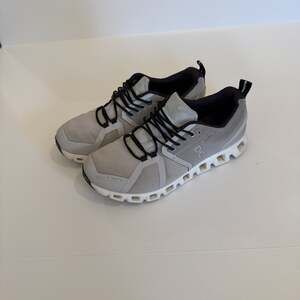 On Running Gray and Black Sneakers